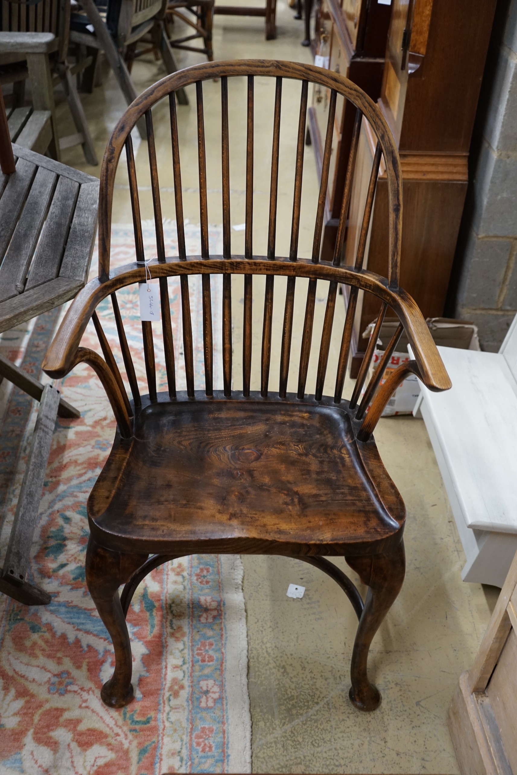 A Windsor elm and beech comb back elbow chair, width 59cm, depth 39cm, height 102cm